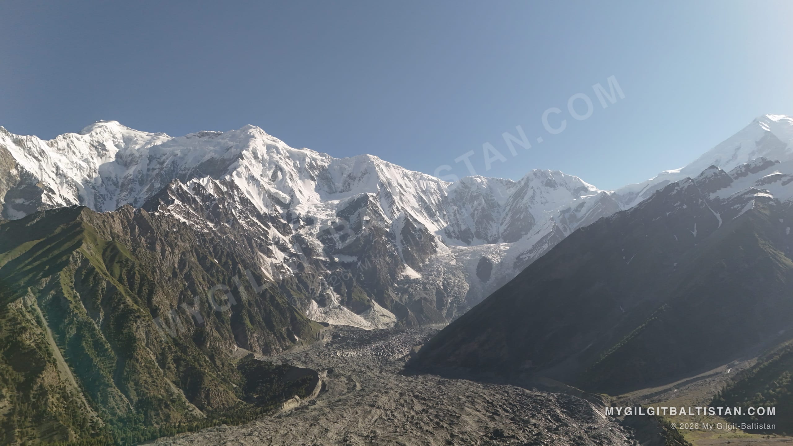 Early light along the ridgeline as the glacier's moraine winds down through the valley.